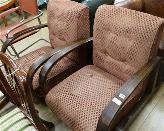 A pair of Art Deco simulated rosewood reclining armchairs